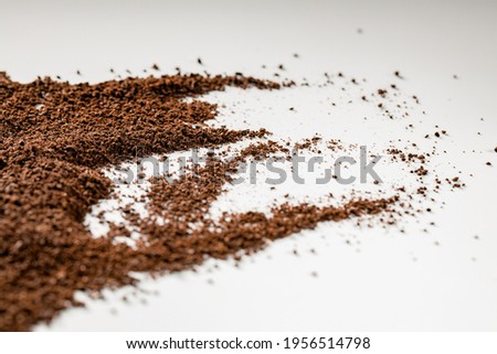 Roasted coffee ground on isolated white background