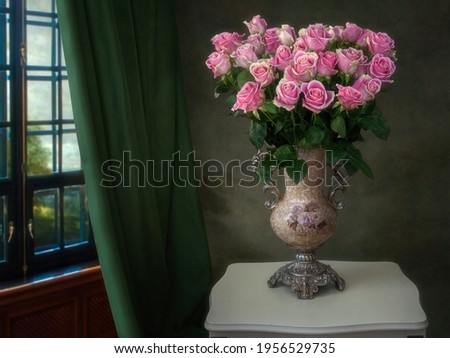 Still life with bouquet of pink roses in old vase