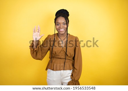 African american woman wearing casual clothes doing hand symbol
