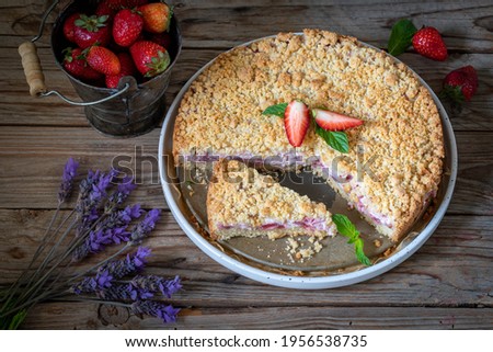 Pie with curd filling and shortcrust pastry strawberries. Sbricholata.