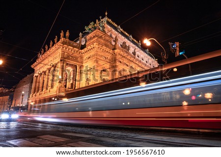 A tram going in front of the Czech National Theatre in night