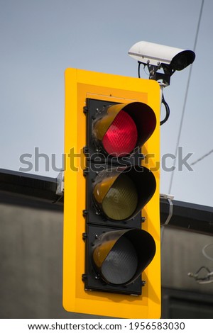 Traffic lights attached to the pole.   