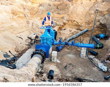 Waterworks long-distance pipeline for the supply of drinking water to the desert city, the suburbs. Problem with poverty and lack of drinking water. Royalty-Free Stock Photo #1956586357
