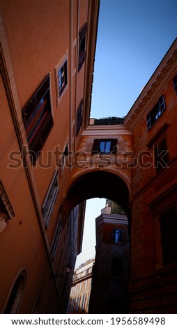Arch and wall of old building in Rome, Italy