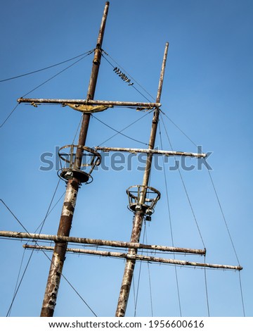 Crow's nest and masts of an old ship Royalty-Free Stock Photo #1956600616