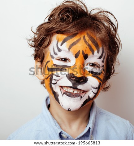 little cute boy with faceart on birthday party close up Royalty-Free Stock Photo #195665813