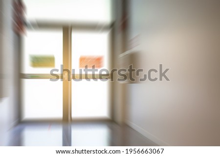 Blurred abstract fire doors in shopping mall.