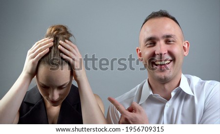 Photo of loser woman on grey background Royalty-Free Stock Photo #1956709315