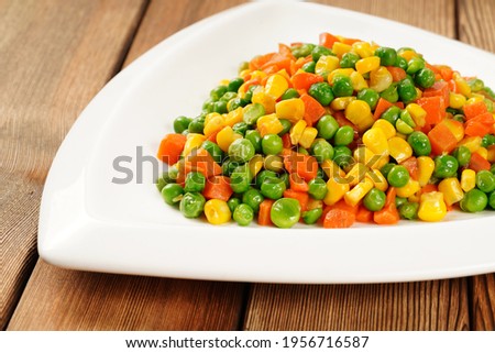 Stir fried beans, corn kernels and carrots