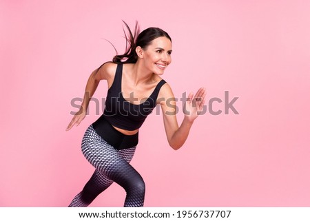 Profile side photo of young sporty woman happy positive smile run fast cross workout isolated over pastel color background