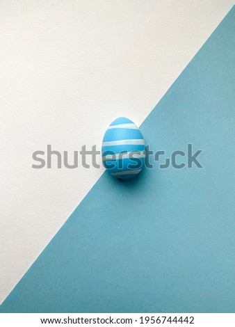 White blue egg on white blue background