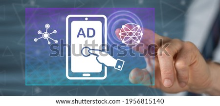 Man touching an advertising concept on a touch screen with his finger