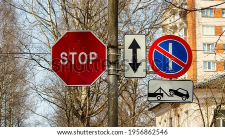 prohibiting and warning road signs on the post by the road