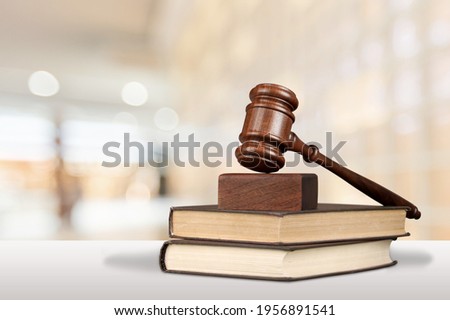 Justice books and wooden gavel on table. Justice concept