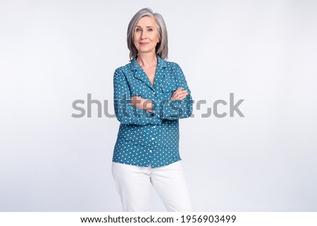 Photo of happy positive good mood confident businesswoman with folded hands isolated on grey color background