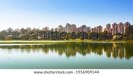 Curitiba, Parana, Brazil - April 10th: Par. City park view in South America city. Parque Barigui, Barigui Park. Morning nature scene. Daylight panorama.  Colorful landscape. Royalty-Free Stock Photo #1956909544