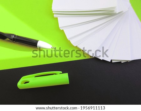 Blank sheets of Notepad , mockup, pen and black green mint  background .  Template with copy space, flat design, layout. Planning concept, education. Workspace.       