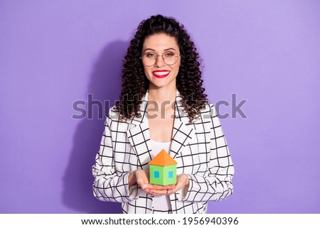 Photo of young excited girl happy positive smile hold hands house buy purchase property isolated over purple color background