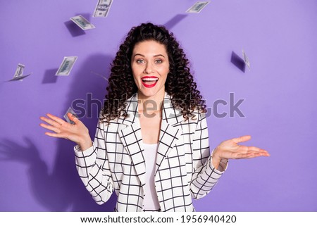 Photo portrait of businesswoman cheerful won lottery banknotes flying in air happy isolated on vibrant violet color background