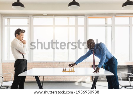 two male businessmen, rivals are playing chess. Strategy and rivalry.