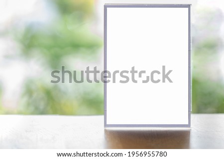 Mockup blank white screen advertising board or showcase billboard in modern department store. Mock up billboard for your text messege or media content with blur department store or shopping mall
