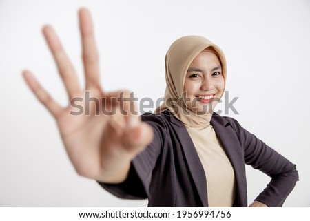 woman entrepreneur wearing hijab OK sign hand pose, office work concept isolated white background