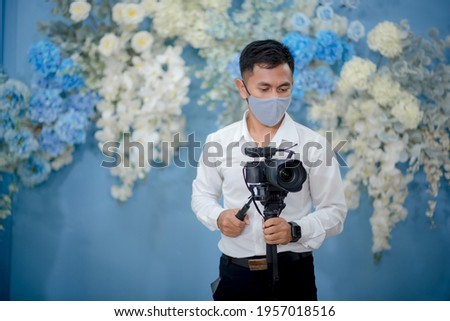 Photographers wear a mask every time while working.