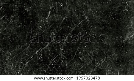 White scratches and dust on black background. Vintage scratched grunge plastic broken screen texture. Scratched glass surface wallpaper. Dirty Blackboard. Space for text. Royalty-Free Stock Photo #1957023478