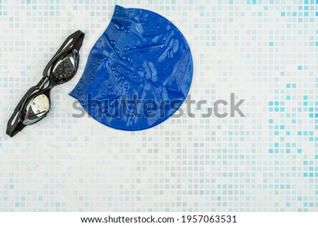 Swimming goggles and swimming cap. Fitness and sport, healthy lifestyle concept Royalty-Free Stock Photo #1957063531