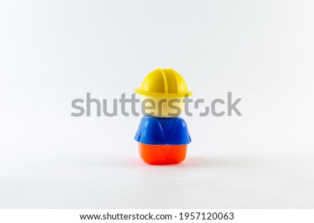 Children's plastic toy , colorful toys ,small boy and red car isolated on white background 