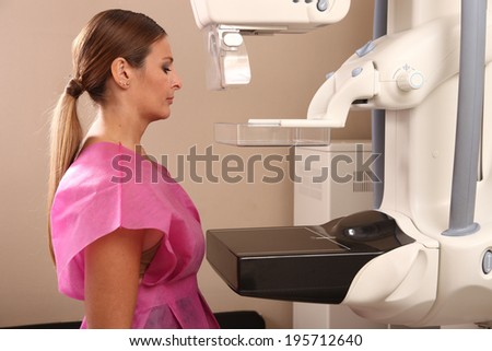 Woman taking a mammogram x-ray test. Mammography machine in a hospital. Royalty-Free Stock Photo #195712640
