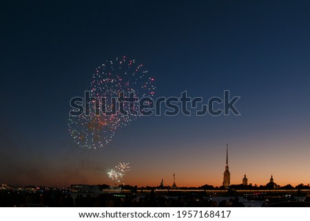 Fireworks over the city after sunset.