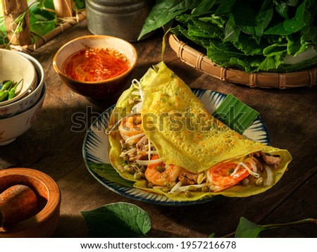Crispy ,Savory Vietnamese Crepes -Vietnamese Pancakes - Banh Xeo Royalty-Free Stock Photo #1957216678