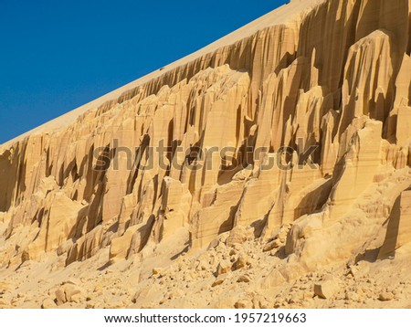 Bright sand formations on the beach in Boa Vista Island, Cape Verde. Geology themed travel picture from a tropical country. Selective focus on the pattern, blurred background.