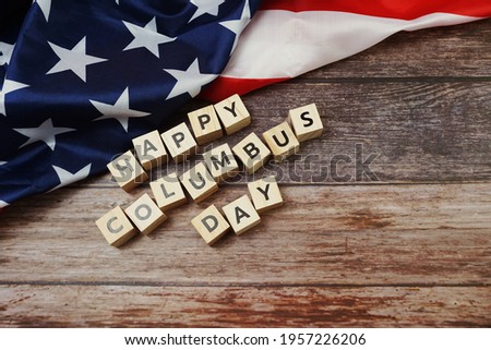 Happy Columbus day Word alphabet letters with USA flag on wooden background