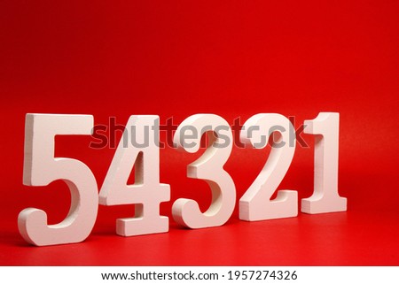 Counting numbers ( 1 2 3 4 5 ) white number wooden on Red Background with Copy Space - One Two Three Four Five  Royalty-Free Stock Photo #1957274326