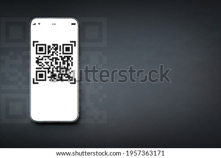 Qr code payment. Digital mobile smart phone with qr code scanner on smartphone screen for payment pay, scan barcode technology on dark background. Online shopping, cashless society concept