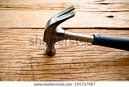 Old Vintage Hammer on Wood Table Background, Rustic Style.