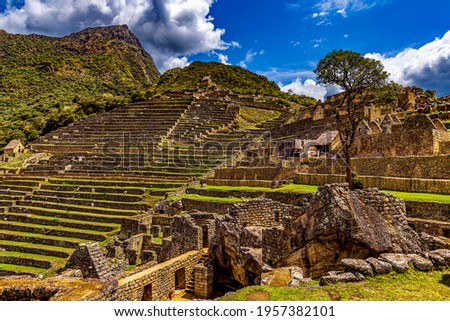 Peru, Eastern Cordillera, Cusco region. Historic Sanctuary of Machu Picchu. Temple of the Condor and cultivation terraces in the background