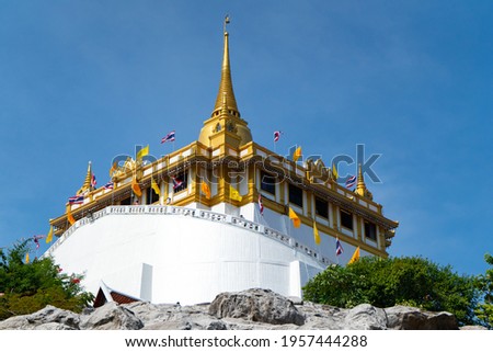 Golden Mountain Temple is an ancient  constructed since the Ayutthaya period at Wat Saket is a Buddhist temple (wat) in Pom Prap Sattru Phai district, Bangkok, Thailand. Royalty-Free Stock Photo #1957444288