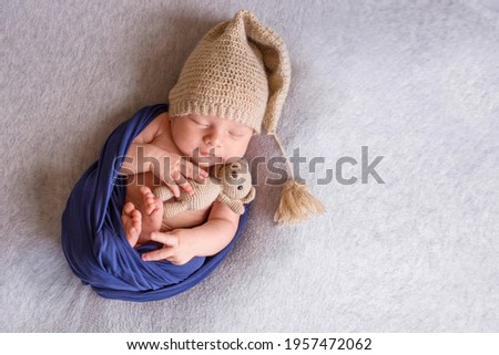 portrait of a small newborn baby boy baby cute sleeping in a crib with a charming view