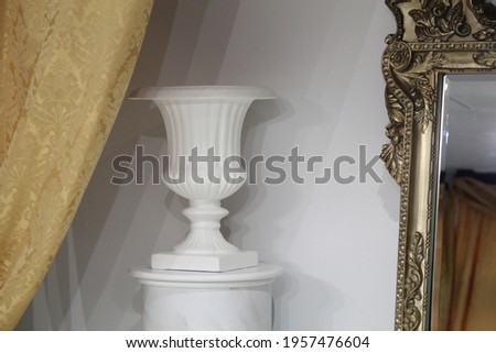 white vase art interior mantle