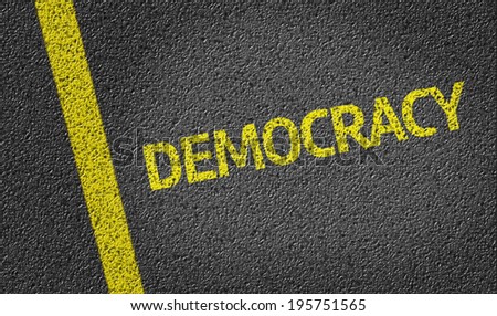 Democracy written on the road