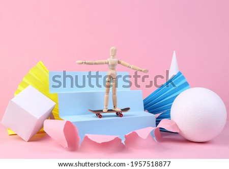 Puppet with skateboard on pink background with geometric shapes. Minmalism. Concept art