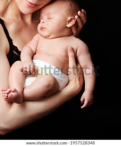 baby in mother's arms and been cared for after having a good sleep in bed stock photo 