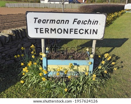 Roadside sign for Termonfeckin village or Tearmann Feichin in the Irish language, in County Louth, Ireland.  Royalty-Free Stock Photo #1957624126