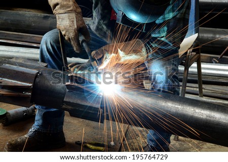 Welder at work  Royalty-Free Stock Photo #195764729