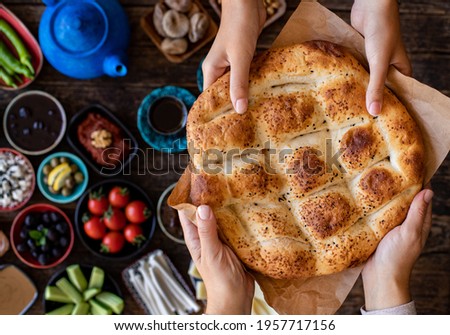 Ramadan pita on the table for suhoor and iftar. Food concept with top view.  Royalty-Free Stock Photo #1957717156