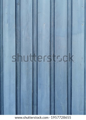 A closeup of a blue wooden wall texture and background  Free space for your text-vertical shot