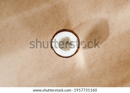Summer abstract creative composition with coconut a on kraft paper. 